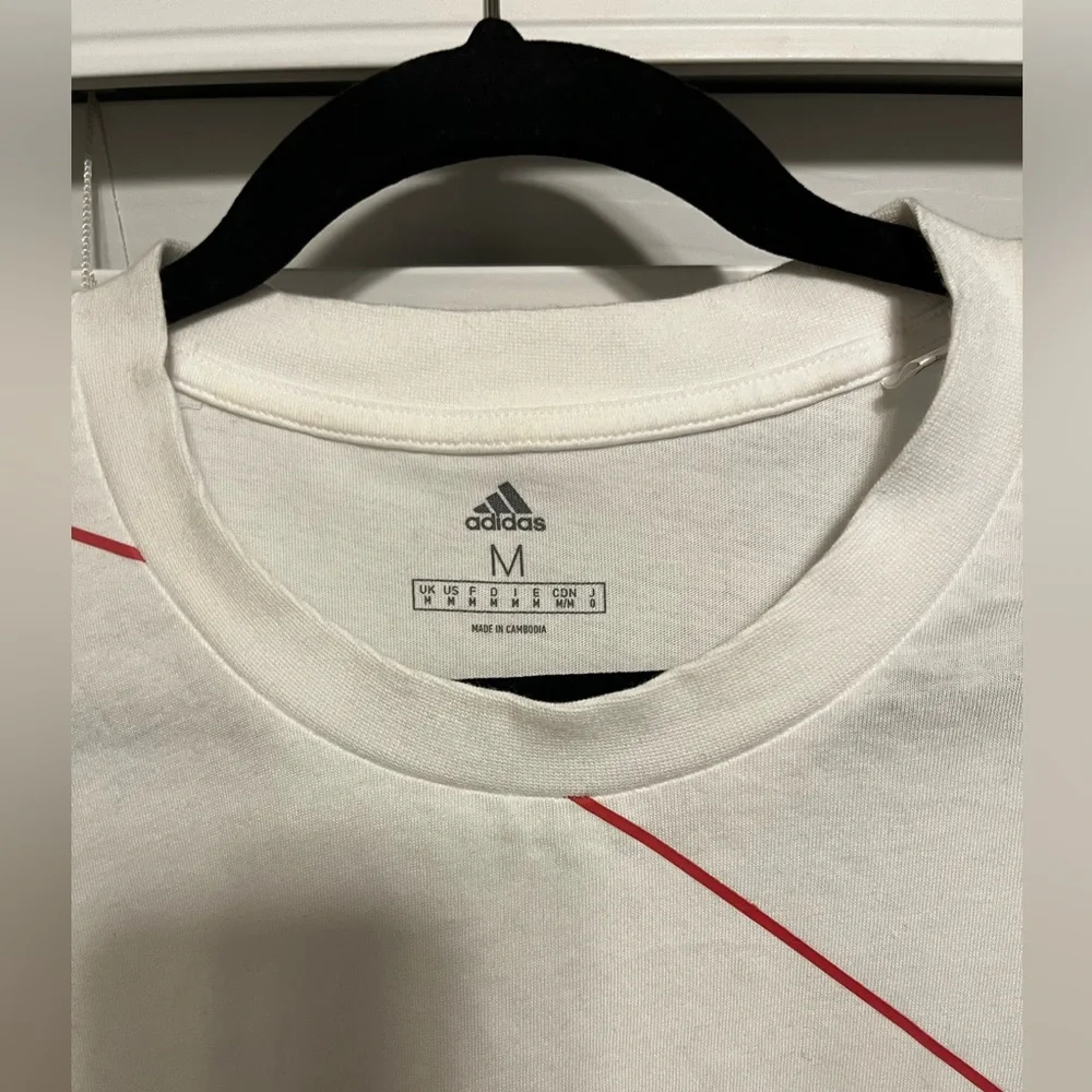 Size M, Adidas, white T-Shirt with red outlined logo letters